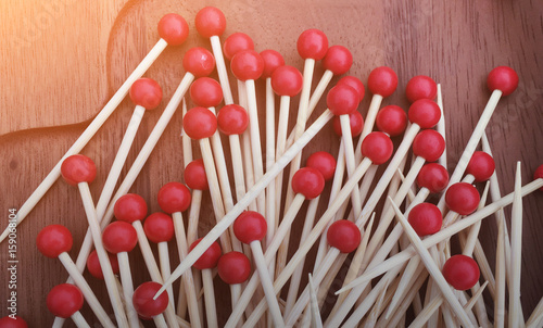 The food pick with red handle ball.