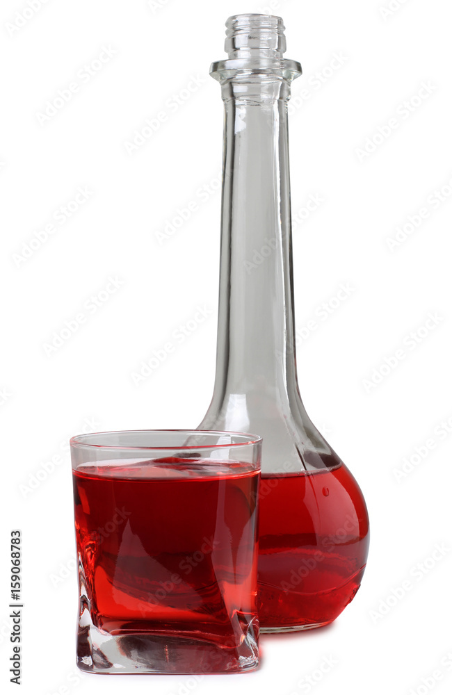Vodka in a glass and decanter on a white background Vodka in a glass and decanter on a white background