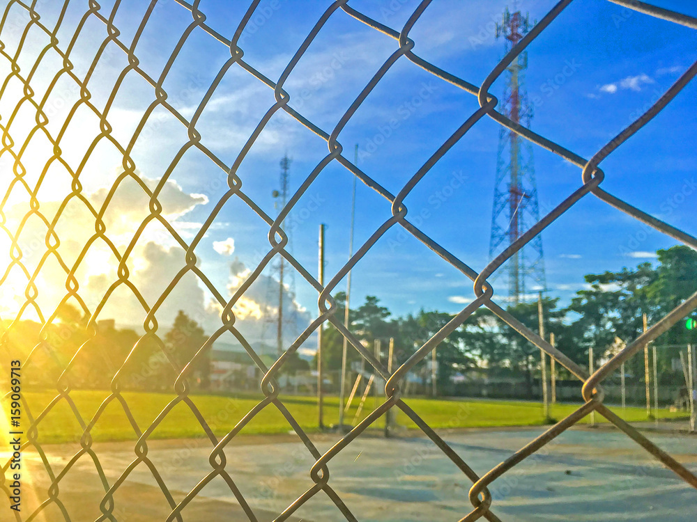 Steel fence cages and Beautiful blue sky with sunset Steel fence cages and Beautiful blue sky with sunset