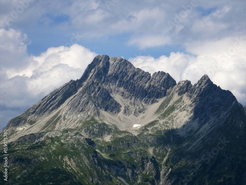 Climate change: last remainder of snow instead of an alpine glacier in the bowl shaped depression formed by the mountain glacier in the process of centuries. Lech Valley, Austria, August 2015. © Andreas Wass