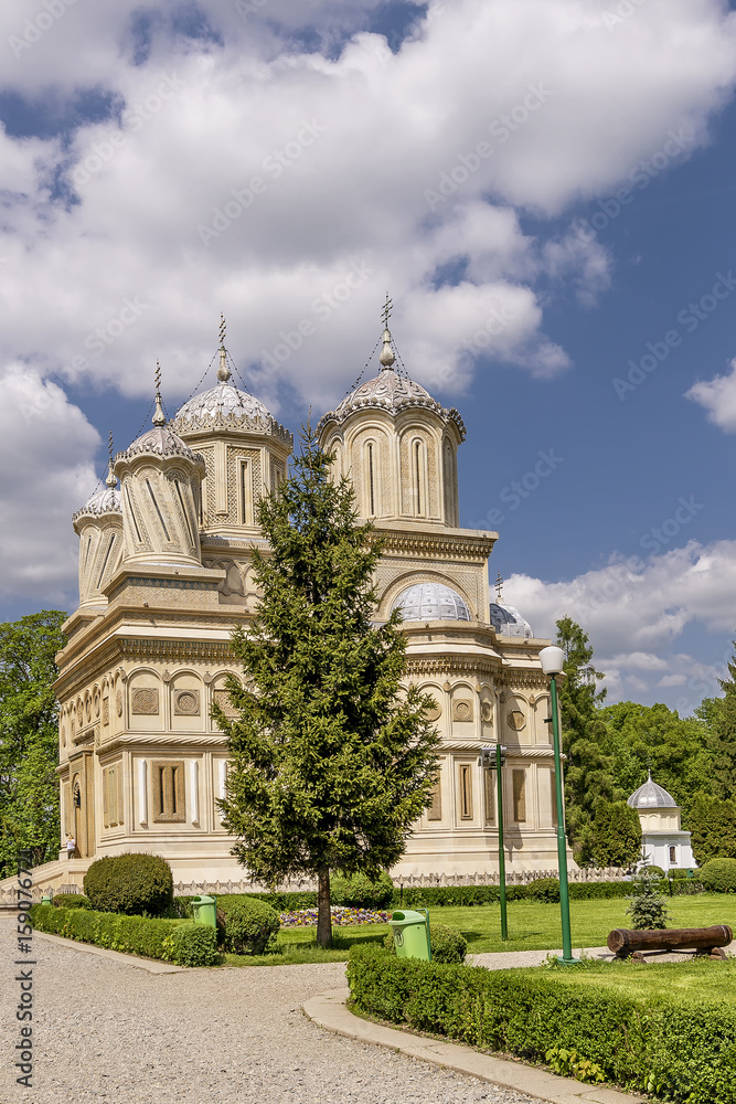 Beautiful vertical view of the Curtea de Arges Monastery and Cathedral on a sunny day, Romania