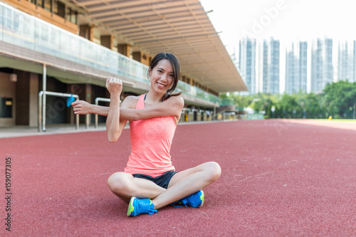 Sport woman stretching hand in sport court