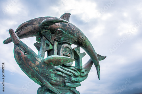 The twin dolphins statue, sympol of Rethimno city, Crete, Greece. photo