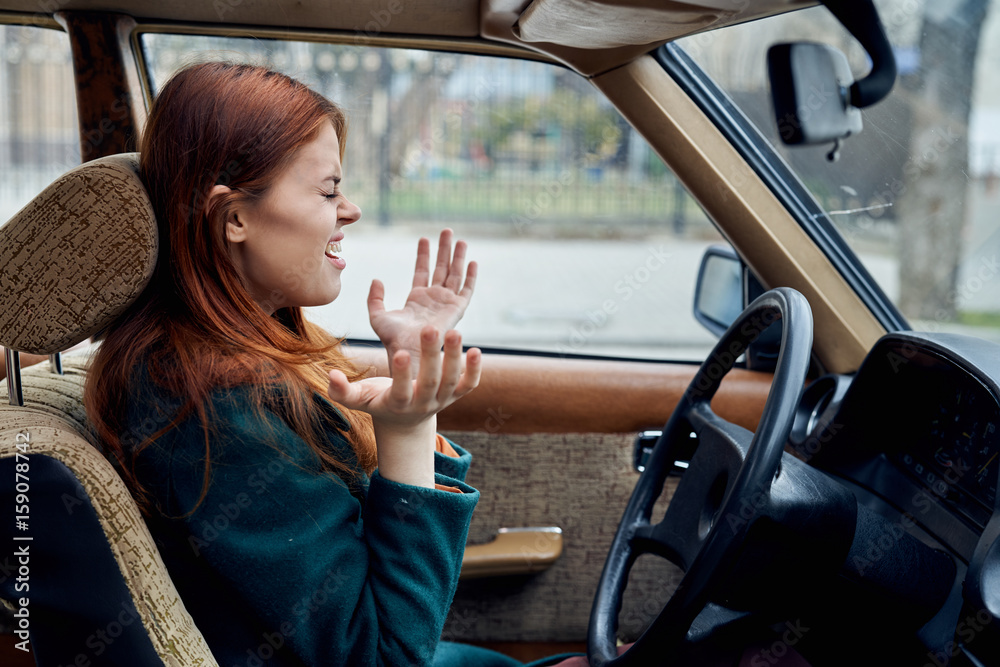 1033314 Woman driving a retro car, young woman driving a car