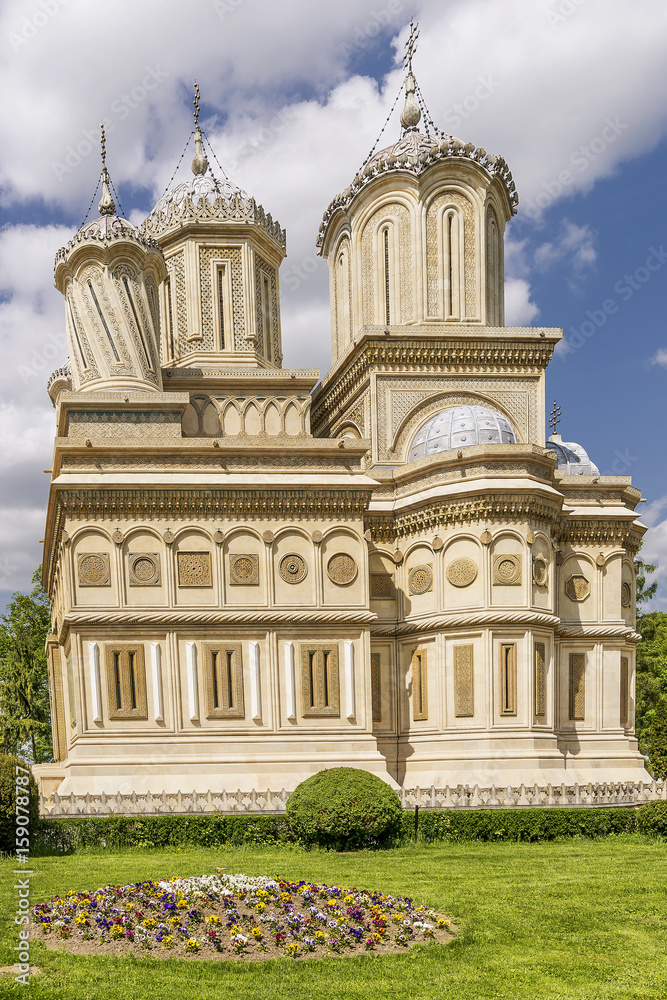 Beautiful vertical view of the Curtea de Arges Monastery and Cathedral on a sunny day, Romania