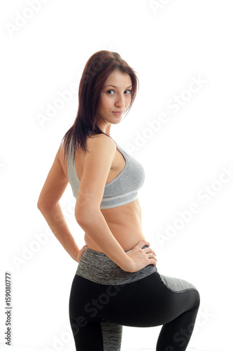 vertical portrait of young beautiful girls in sports trousers and top