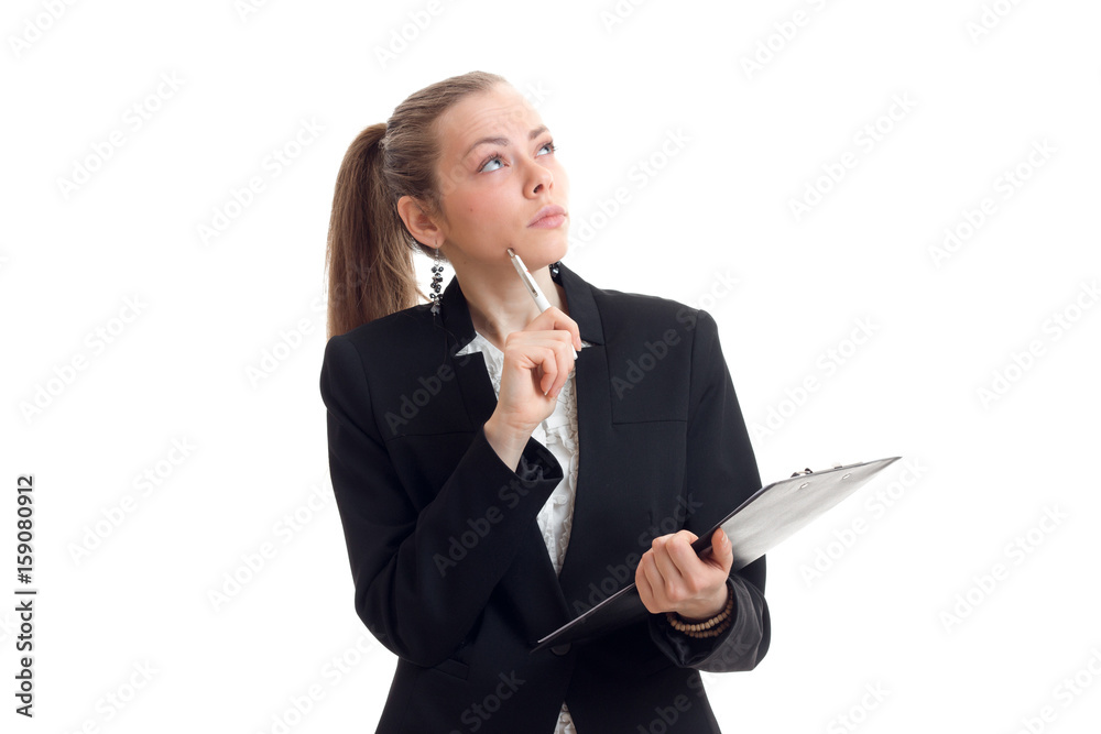 a serious young business woman holding a Tablet and looks up a serious young business woman holding a Tablet and looks up