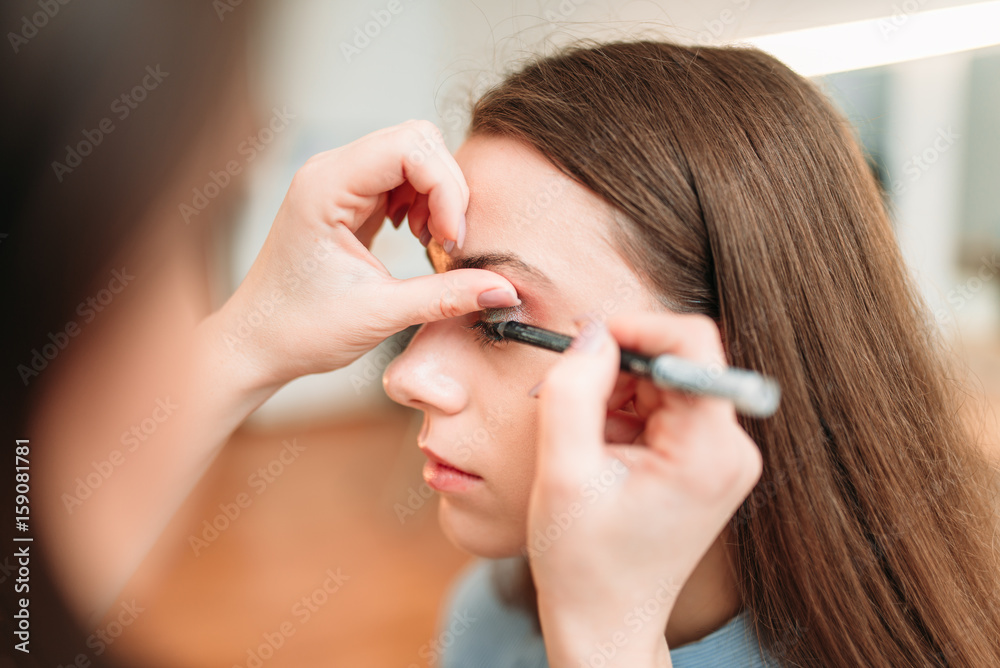 Make up artist work with woman eyes Make up artist work with woman eyes