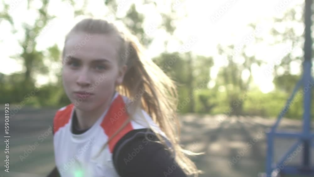 Basketball. The girl is training on the basketball court. Early morning. Basketball. The girl is training on the basketball court. Early morning.