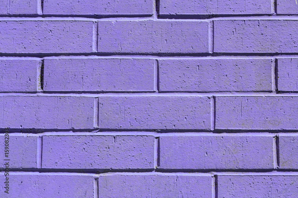Fototapeta premium Purple painted brick wall texture background