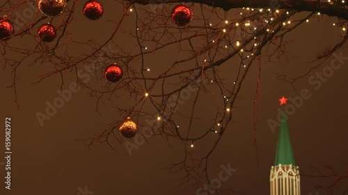 Moscow is decorated for New Year and Christmas holidays. Christmas balls on the branches of trees near the Cathedral of St. Basil the Blessed on Red Square. New Year theme. photo