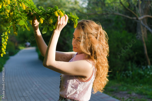 young and happy girl in the sunshine photo