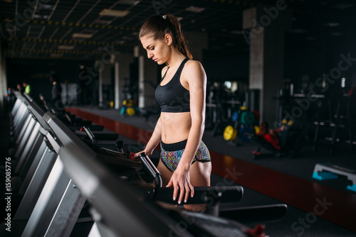 Female athlete exercise on treadmill in sport gym