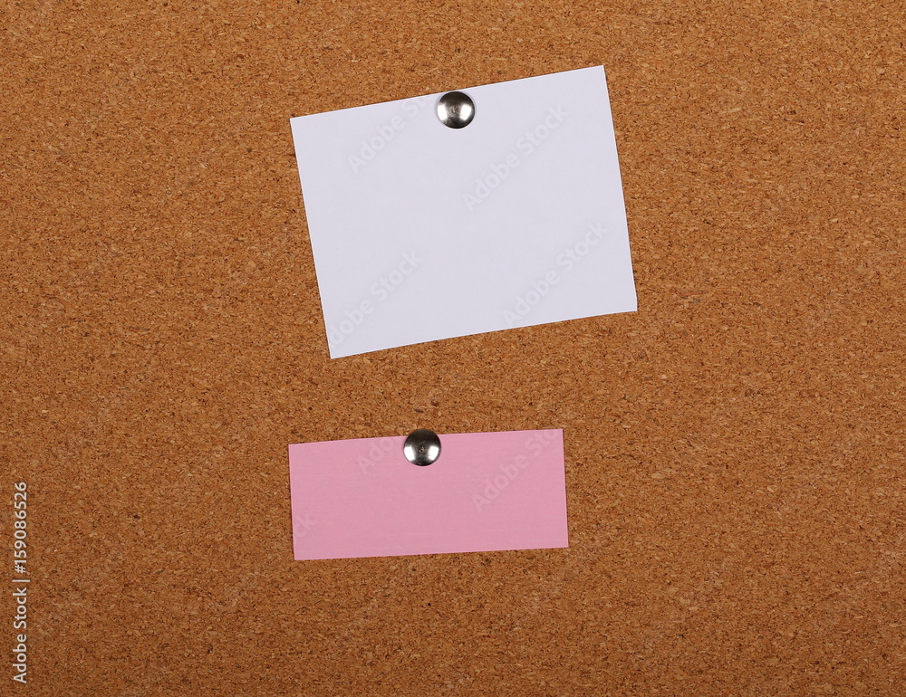 Sticky notes pinned on cork bulletin board background and texture Sticky notes pinned on cork bulletin board background and texture