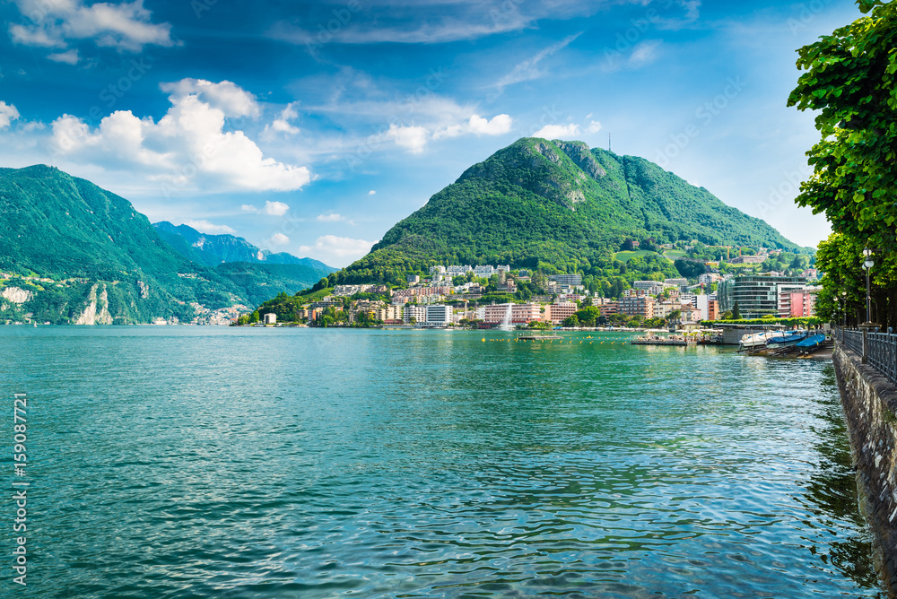 Lugano, Canton Ticino, Switzerland. Lakeside and Lake Lugano on a beautiful summer day. Lugano - Paradiso and Monte San Salvatore