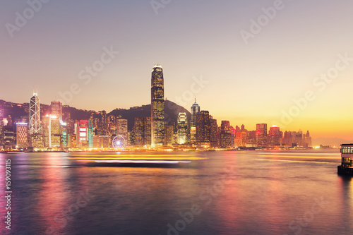 Cityscape and skyline at victoria harbour in hong kong city at twilight time.