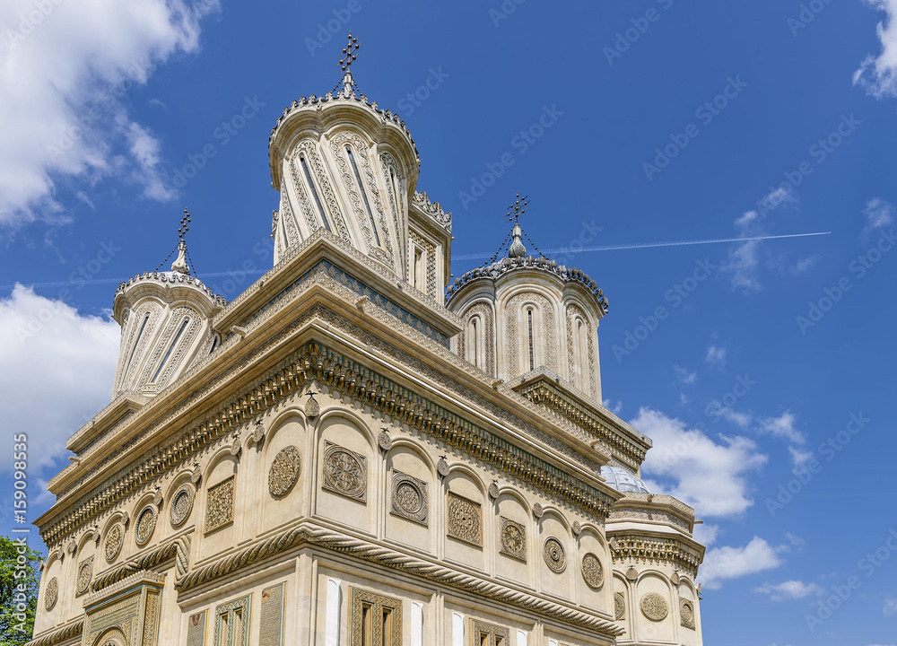 Detail of the top of the Curtea de Arges Monastery and Cathedral on a sunny day, Romania