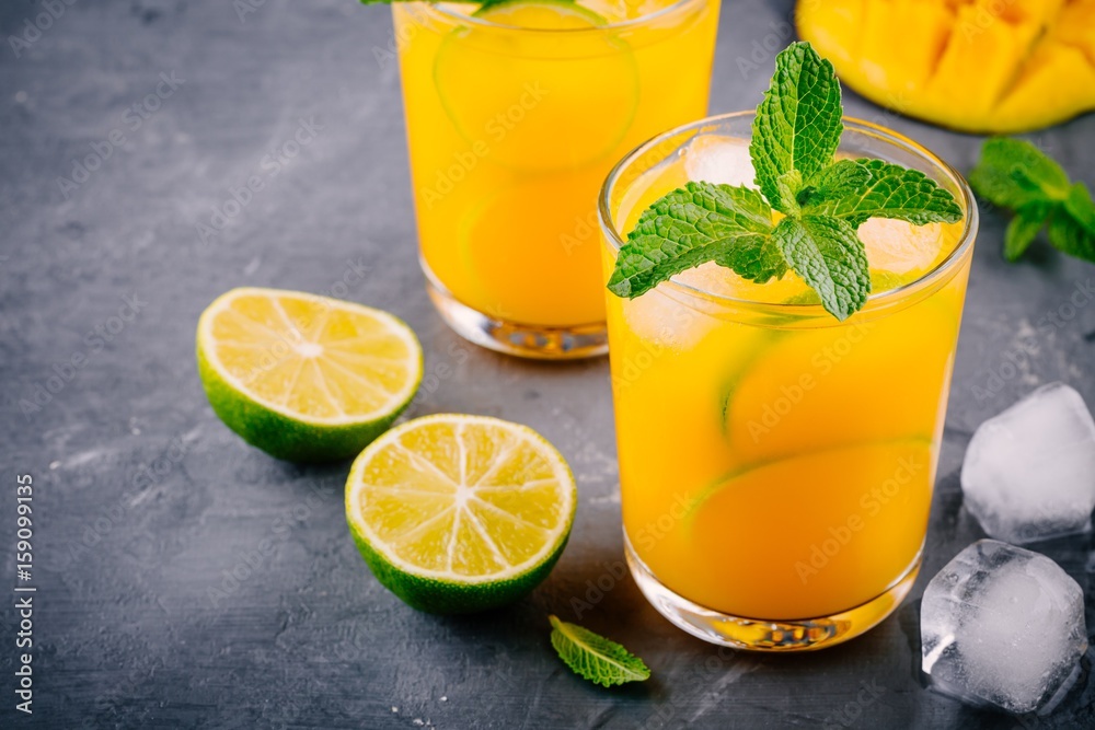 Fresh summer mango cocktail with lime and mint Fresh summer mango cocktail with lime and mint