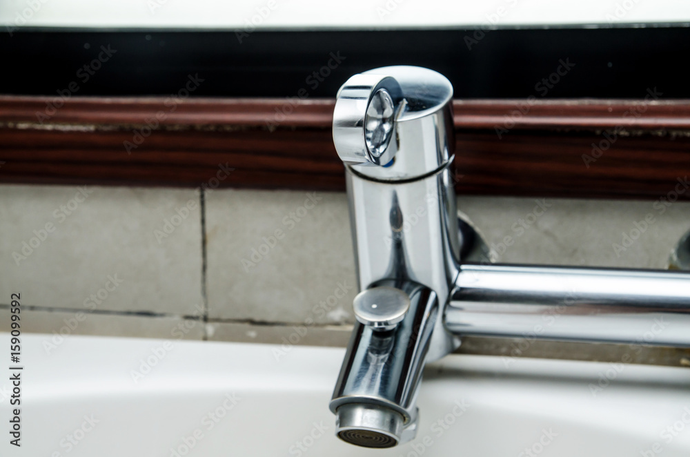 Modern faucet closeup with water drop (water, tap, sink) Modern faucet closeup with water drop (water, tap, sink)