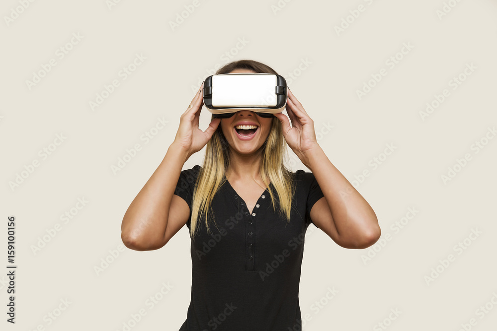 Young woman looking via virtual reality device Young woman looking via virtual reality device