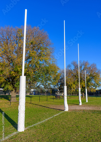 Four Australian Football goal posts in a suburban park in Melbourne Australia