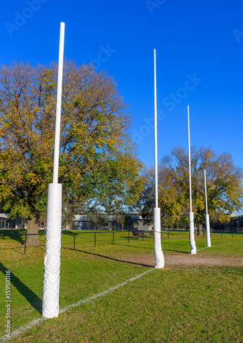 Four Australian Football goal posts in a suburban park in Melbourne Australia photo