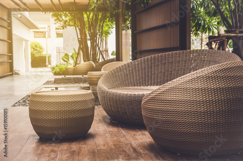 outdoor furniture rattan armchairs and table on terrace photo