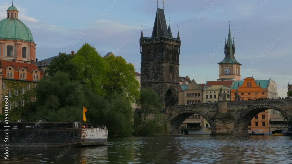 Cinematic view of the Charles Bridge and Tower from the Vltava river in Prague, Czech Republic, Czechia. Cinematic view of the Charles Bridge and Tower from the Vltava river in Prague, Czech Republic, Czechia.