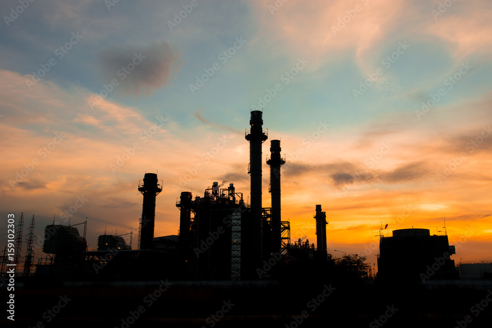 Silhouette of Industrial power plant at twilight.