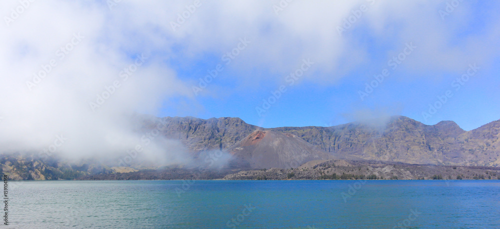 Scenery of lake and Baru volcano inside Rinjani mountain, active volcano at Lombok island of Indonesia.
