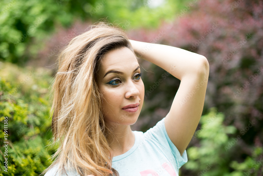 Portrait of a young beautiful woman in glasses, on a green background summer nature. Portrait of a young beautiful woman in glasses, on a green background summer nature.