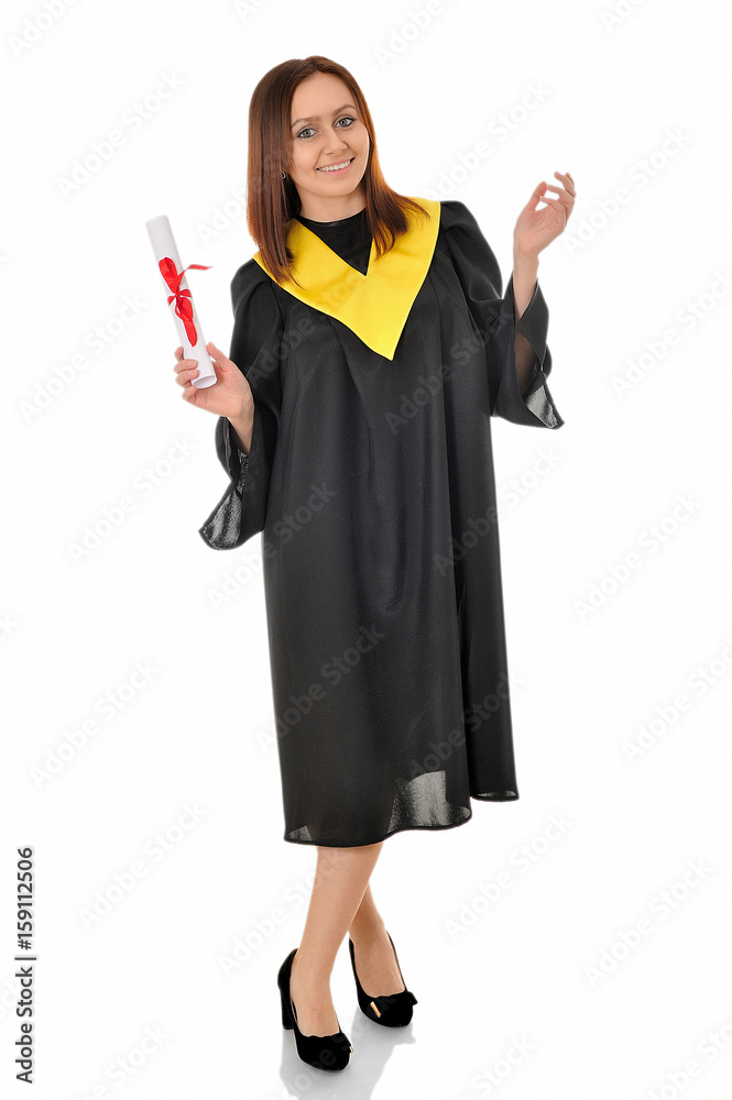A beautiful girl in black gown of the graduate standing with a scroll in her hands A beautiful girl in black gown of the graduate standing with a scroll in her hands