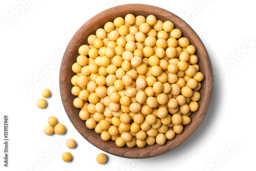uncooked soybeans on white, top view