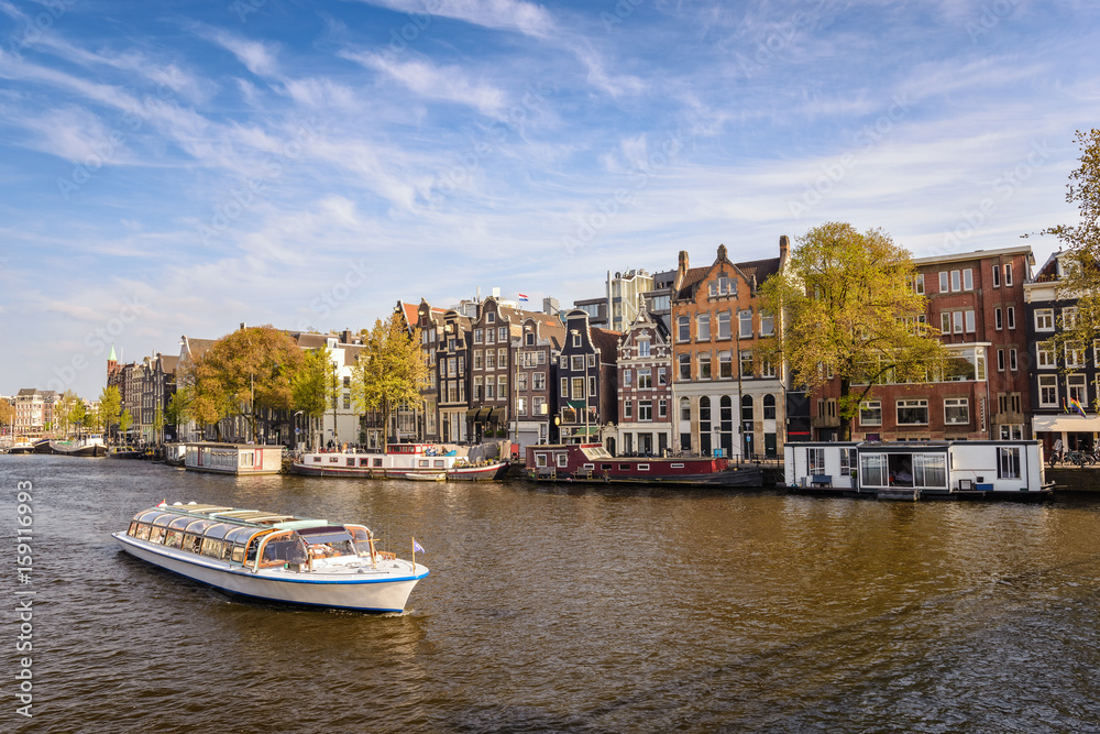 Fototapeta premium Amsterdam city skyline at canal waterfront, Amsterdam, Netherlands