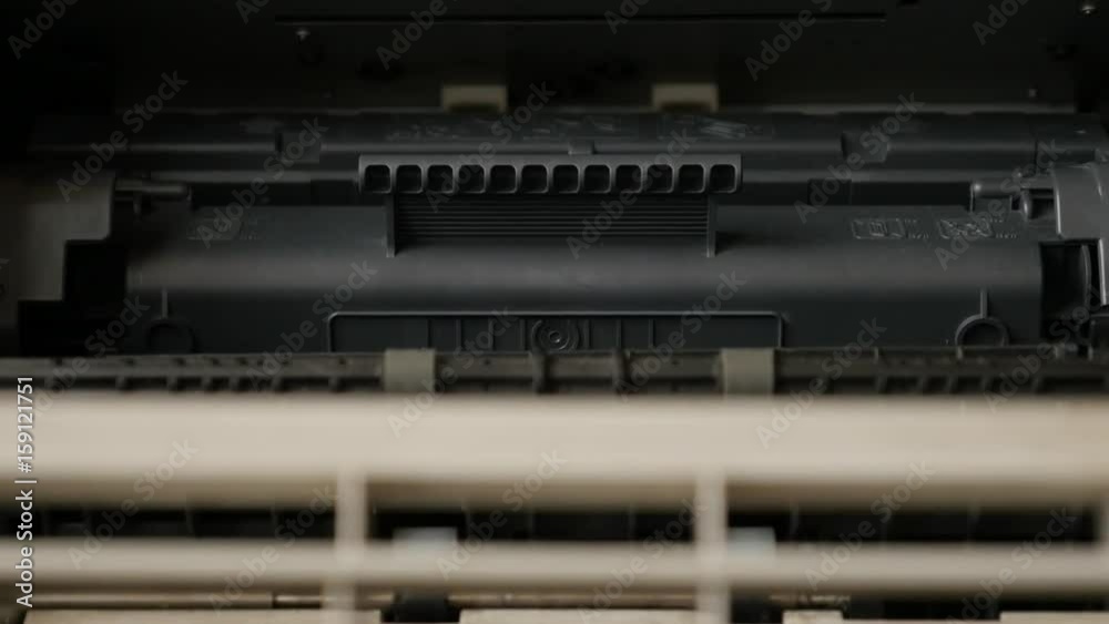 Detailed interior of modern laser printer with toner slow tilt 4K 2160p 30fps UltraHD footage - Refurbished cartridge inside office printing device 3840X2160 UHD tilting video Detailed interior of modern laser printer with toner slow tilt 4K 2160p 30fps UltraHD footage - Refurbished cartridge inside office printing device 3840X2160 UHD tilting video