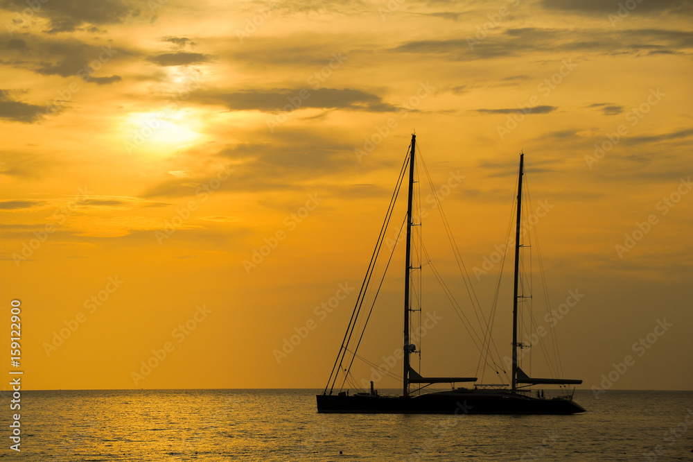 silhouette of sailing yacht in Beautiful Sunset at andaman sea