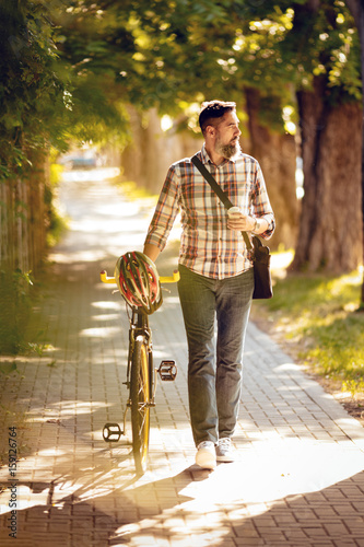 Fotografía Casual Businessman Going To Work By Bike