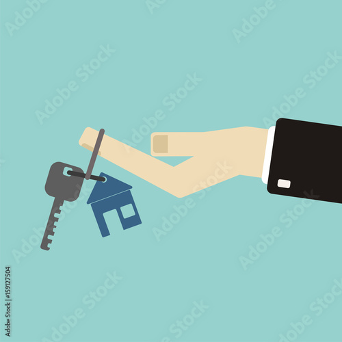 Real estate concept in flat style - hand of a real estate agent holding a home key with a tag.
