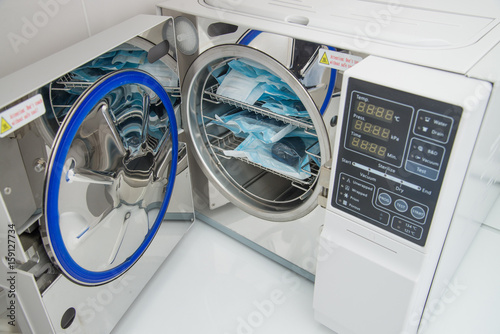 Modern laboratory autoclave sterilizer in dentistry sterilization department photo