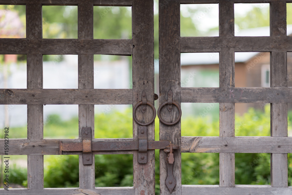 old wooden lattice on the gates in a monastery Russia
