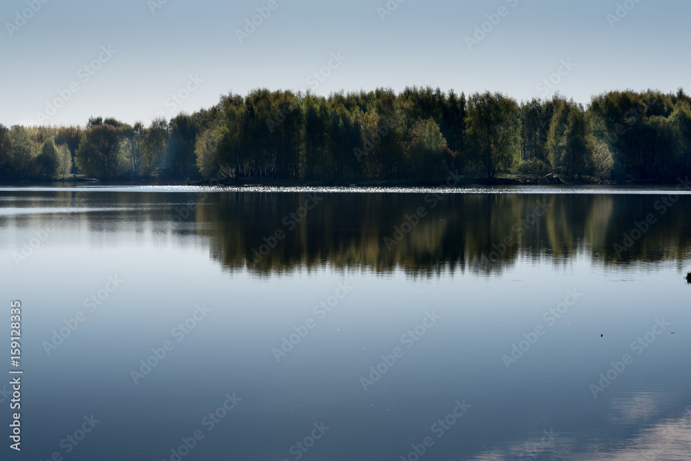 Landscape with trees, reflecting in the water Landscape with trees, reflecting in the water