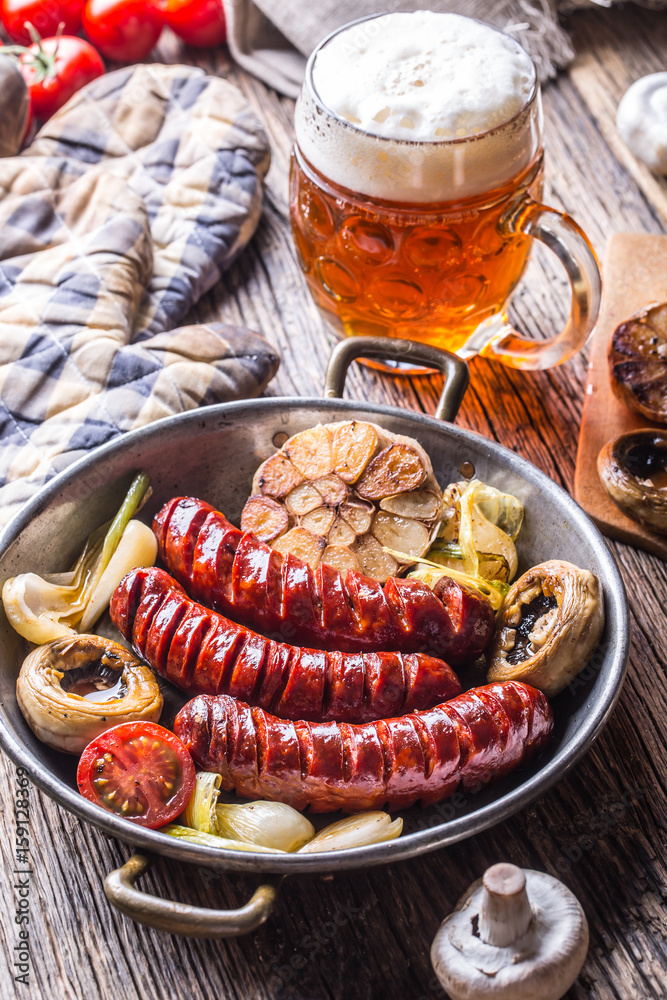 Sausages. Grill sausages. Grilled sausage with beer mushrooms garlic tomatoes and onions. Sausages. Grill sausages. Grilled sausage with beer mushrooms garlic tomatoes and onions.