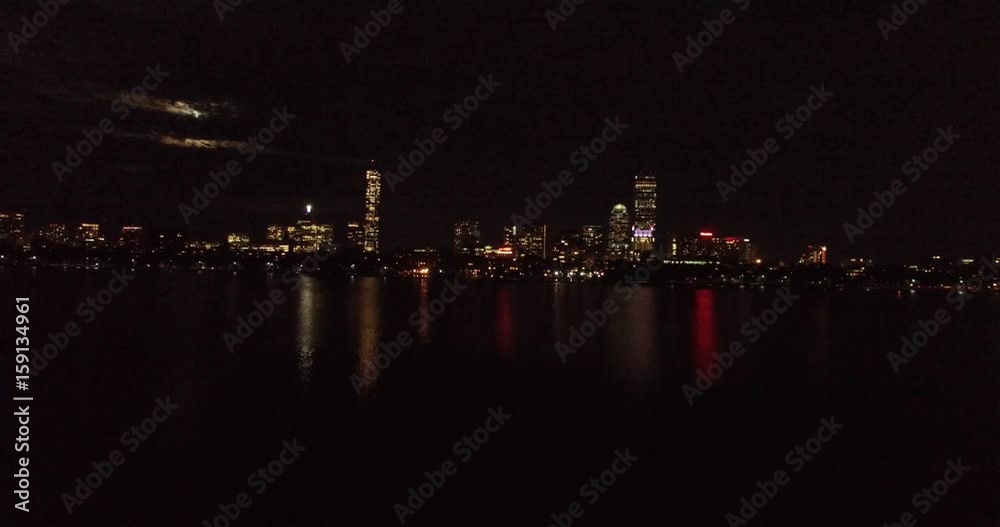 Approaching aerial shot of night Boston skyline, Charles River, Back Bay, John Hancock and Prudential tower Approaching aerial shot of night Boston skyline, Charles River, Back Bay, John Hancock and Prudential tower