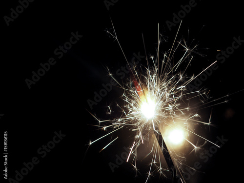 Night background with a sparkler. Sparkler Bokeh Colorful sparkler.