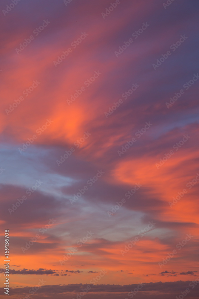 Abstract background of beautiful morning sunrise sky with orange and pink clouds