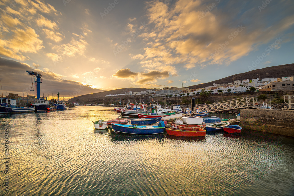 Fototapeta premium Sunset over a port in Gran Tarajal, Fuerteventura, Canary islands