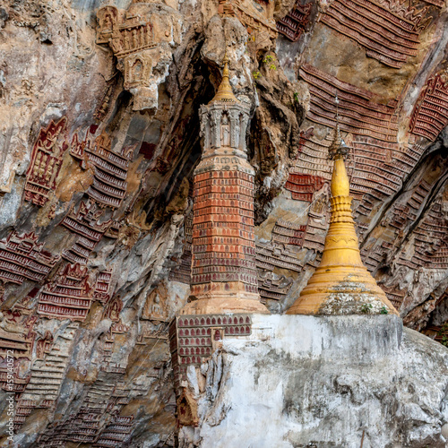 Old buddhist pagoda with carvings in Kaw Goon cave, Myanmar. photo