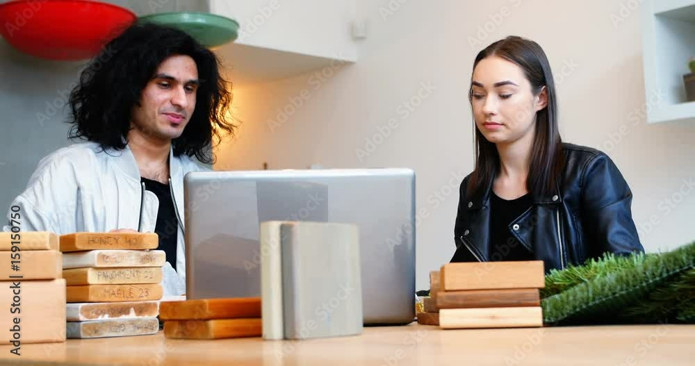 Executive using laptop while having breakfast Executive using laptop while having breakfast