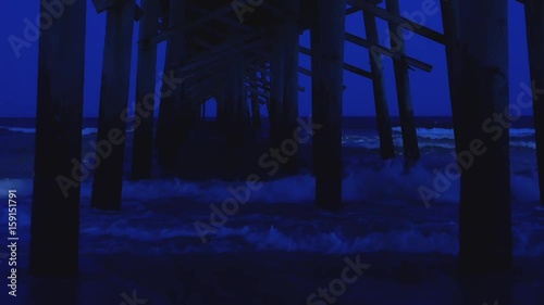 Ocean Waves Under a Dark Pier, Night Sky