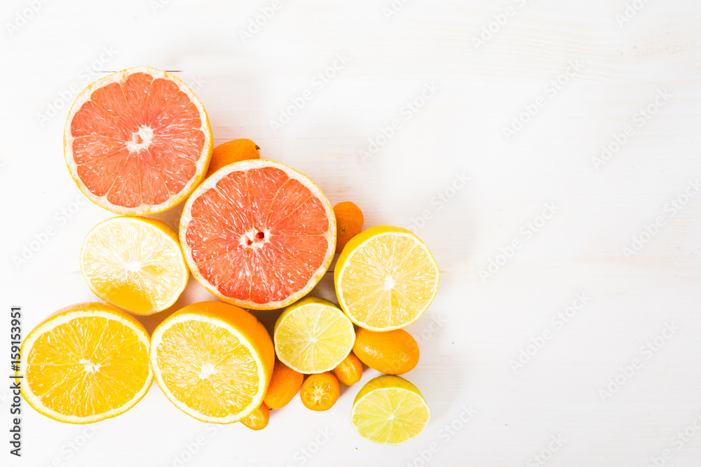 Different citrus on hite wooden table top view Different citrus on hite wooden table top view